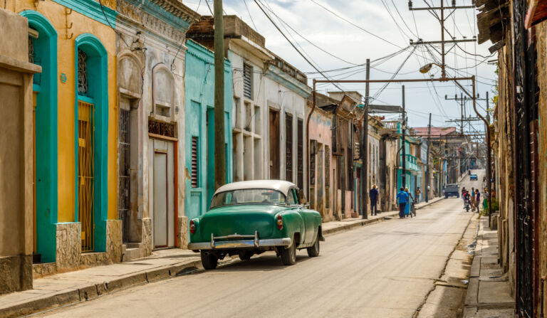 Old living houses across the road in the center of Santiago De Cuba, Cuba