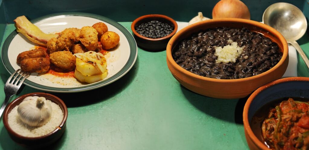 Detail of typical assorted cuban dishes over green surface