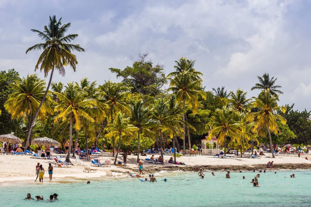 A busy stretch of beach on the Guardalavaca coast in Cuba.