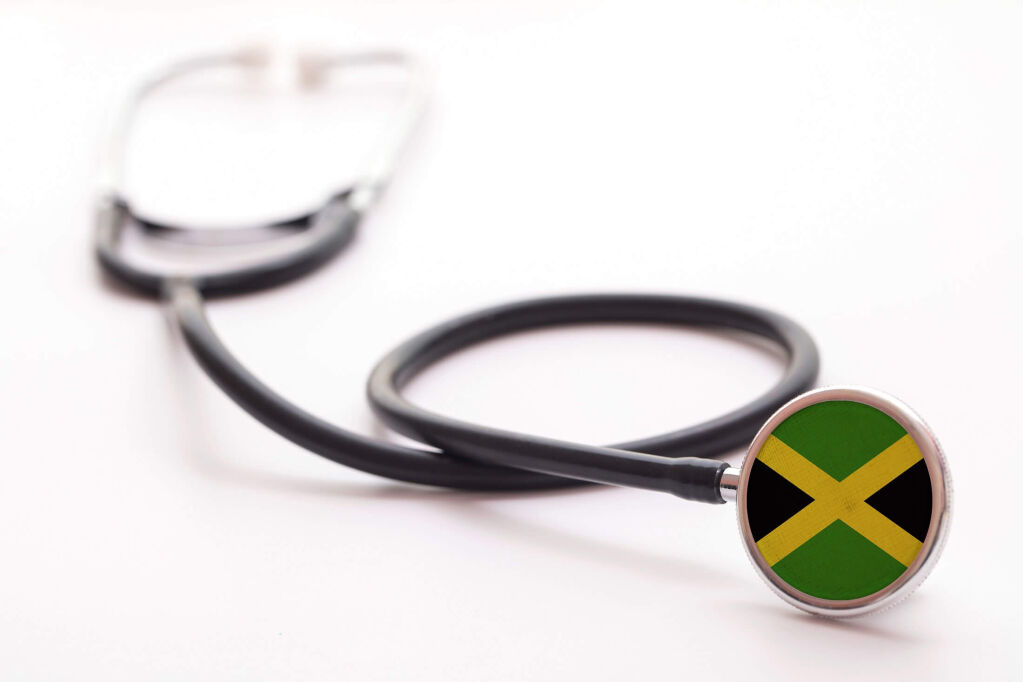 Jamaica healthcare concept. Medical stethoscope with country flag