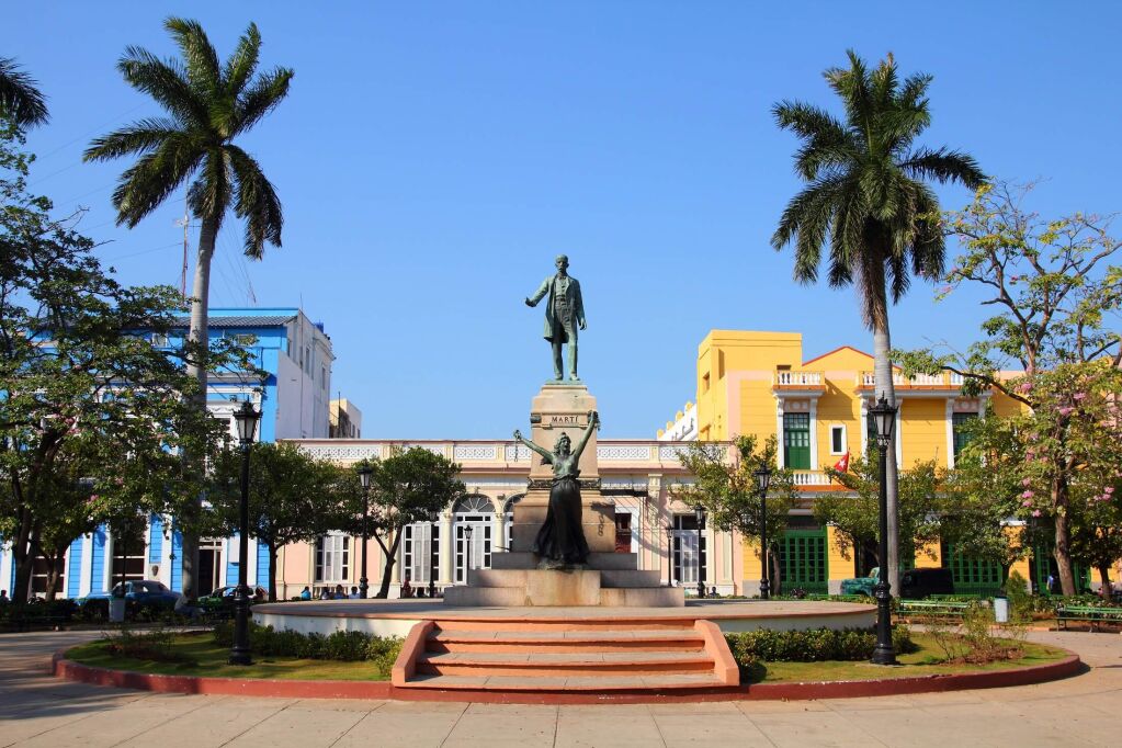 Matanzas, Cuba - main square. Palm trees and statue depicting Jose Marti and Liberty.
