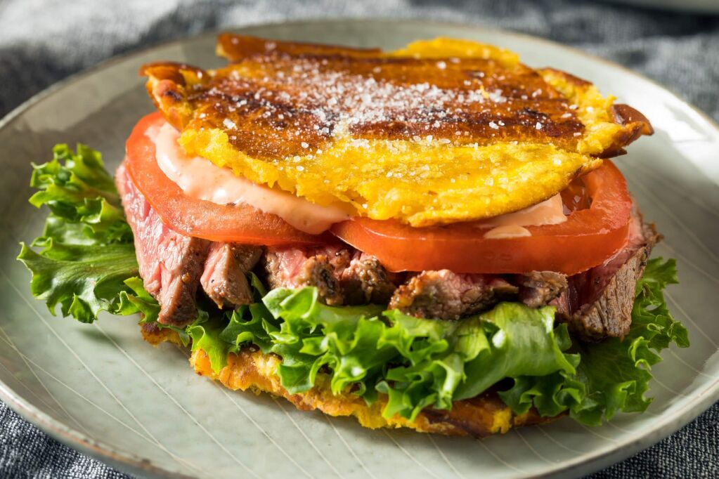 Homemade Puerto Rican Jibarito Steak Sandwich with Lettuce and Tomato
