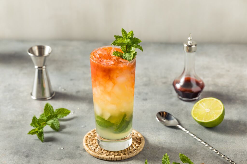 Boozy Refreshing Queens Park Swizzle with MInt Rum and Bitters